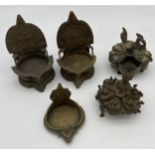 Two antique Indian powder boxes and three oil burners.