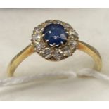 Antique ladies gold ring, set with a large single Sapphire stone surrounded by diamond cluster [2.