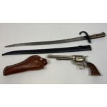 An 19th century Bayonet with scabbard together with replica colt gun and holster.