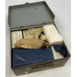 A WW2 First aid box containing contents.