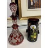 Bohemian facet cut small decanter together with a purple antique glass with hand painted design.