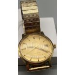 A Gent's Vintage Gold cased Omega Automatic Geneve watch. In a working condition. Engraved with