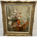 An original oil painting on canvas depicting still life flowers and vase. Signed by the artist.