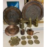 A Collection of middle east brass and copper wares to include chargers, tea pots, African weaved