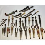 A Collection of tribal daggers and sheaths