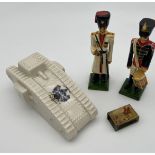 Antique porcelain crested ware tank model, two wooden soldier figures and hunt scene matchbox