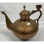 A Large Antique Indian copper style tea pot. Highly detailed engraved panel work. [42cm in height]