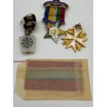 A Lot of three Masonic fob jewels. Includes Silver and enamel star shaped jewel, Yellow metal and