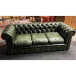 Chesterfield settee in button upholstered green leather