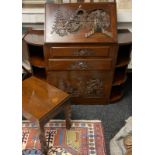 20th century rosewood bureau with carved oriental design, with two central drawers flanked by