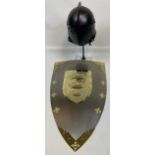 A Replica knights helmet and replica shield wall display.