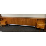 A Mid century teak king size headboard, designed with two, two drawer units. [76x285x34cm]