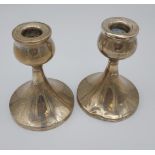 A Pair of Birmingham silver candle sticks. [12.5cm in height] [weighted]