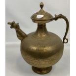 A Large antique Indian gilt brass engraved tea pot. Designed with a dragon style head spout and