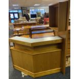 A Mid century teak bar. designed with a two section glass sliding display area. Fitted with