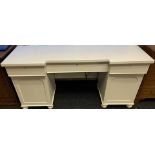 Antique painted desk, rectangular surface above a long central drawer flanked by shorter drawers and