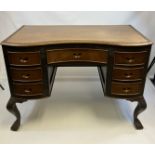 Oak kidney-shaped front desk, centre drawer with carved grip, flanked by banks of three shorter