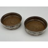 A Pair of Georgian London silver and wood wine coasters/ cooler dishes.