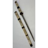 A Japanese samurai short sword with scabbard. hand carved hilt and scabbard. [as found] [75cm in