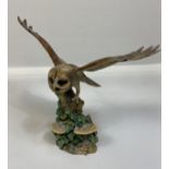 A Border fine arts owl taking off, dated 1986.