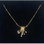 A Ladies 9ct gold necklace with an 18ct gold and diamond 7 piece pendant. [9.33grams]