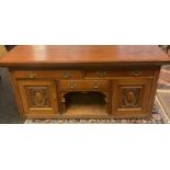 A Large Victorian heavy oak sideboard, designed with three drawers and two doors. [90x191x59cm]