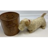 A Vintage straw filled mohair dog figure together with a hide leather bin.