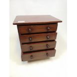 Antique dark wood apprentice chest with 4 drawers and button handles. (33cmx31cmx22.5)