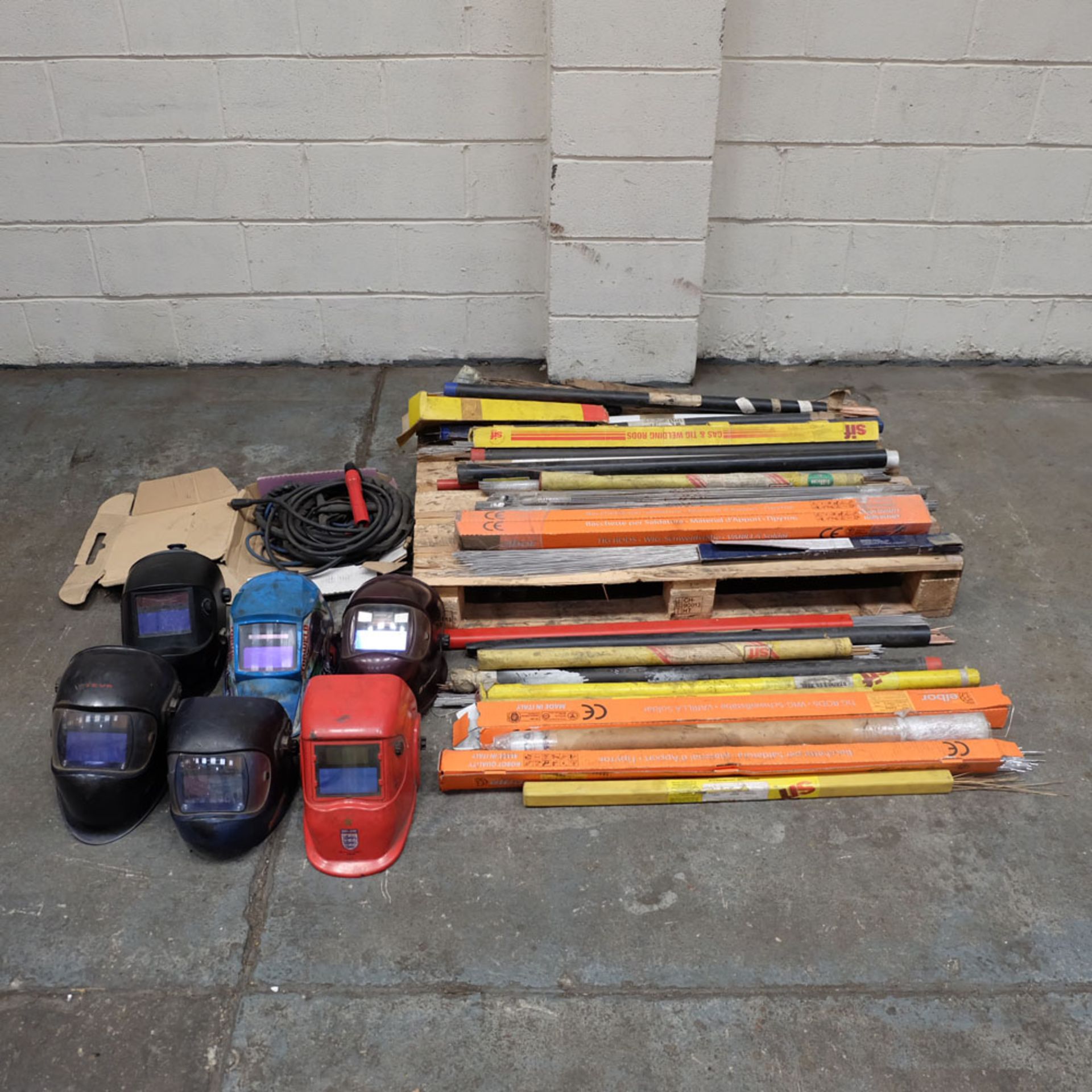 Large Lot of Various Welding Equipment including Welding Rods and Welding Masks.