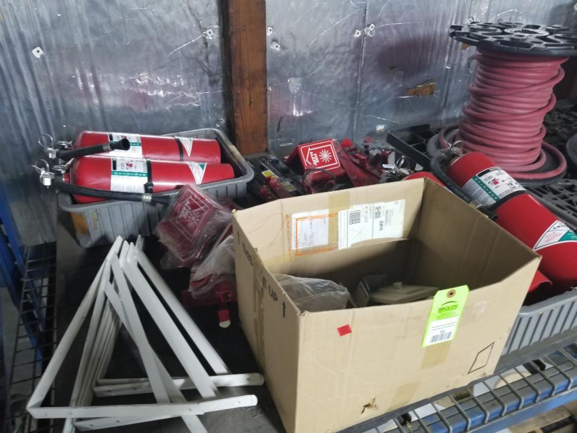 Pallet of assorted fire safety equipment.