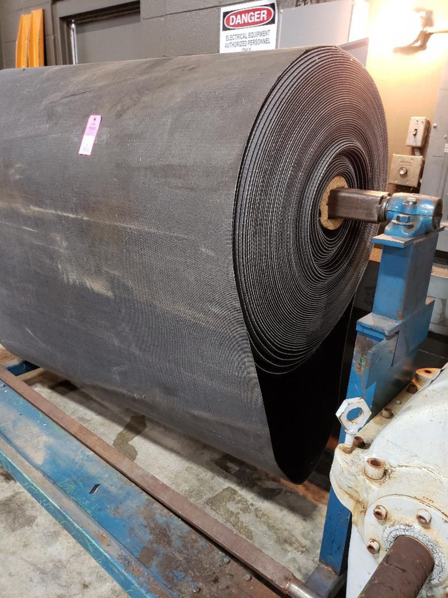 Large roll of conveyor with stand. 66" wide. Roll is approx 32" in diameter. - Image 8 of 8