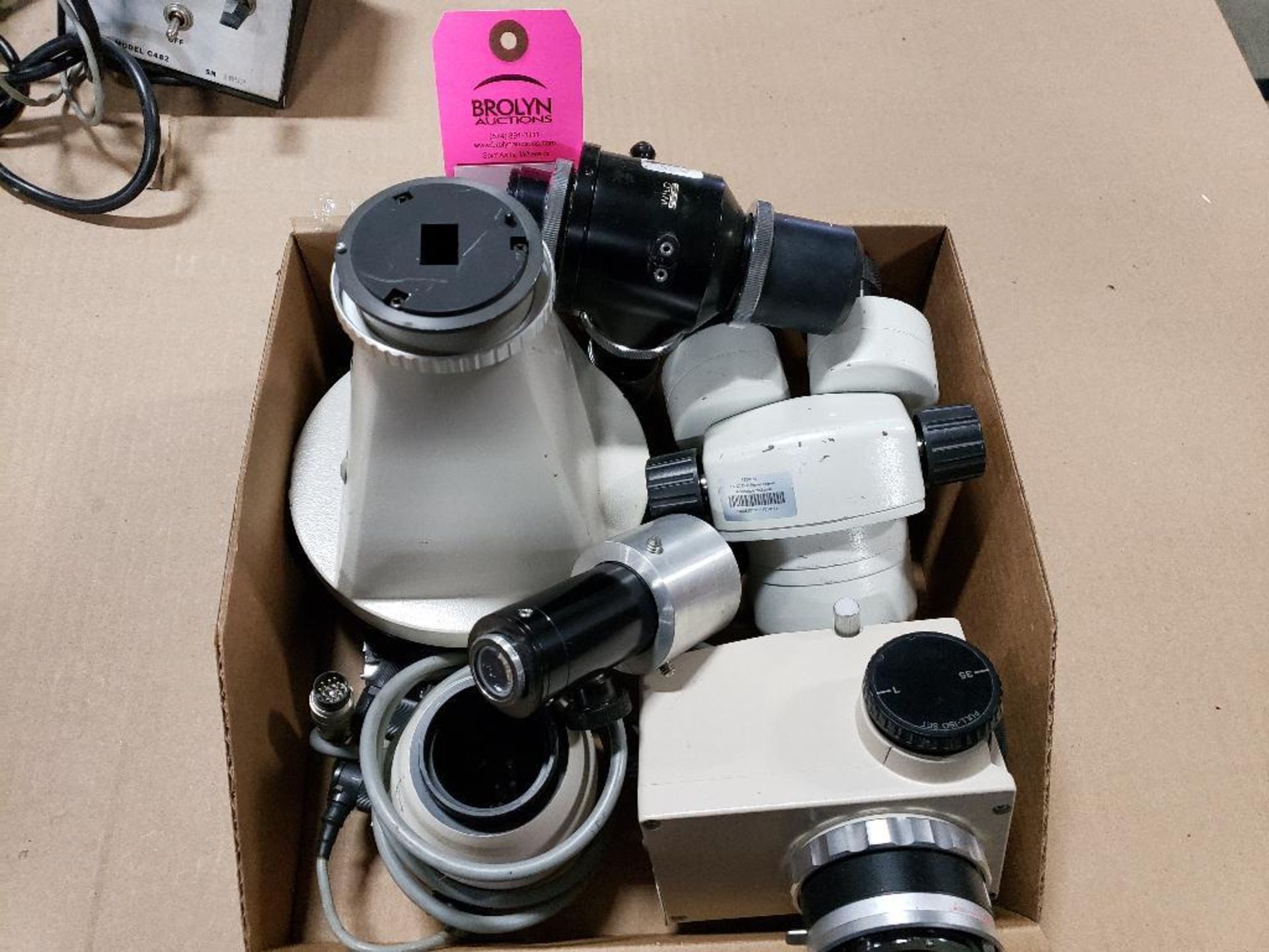 Assorted microscope components.