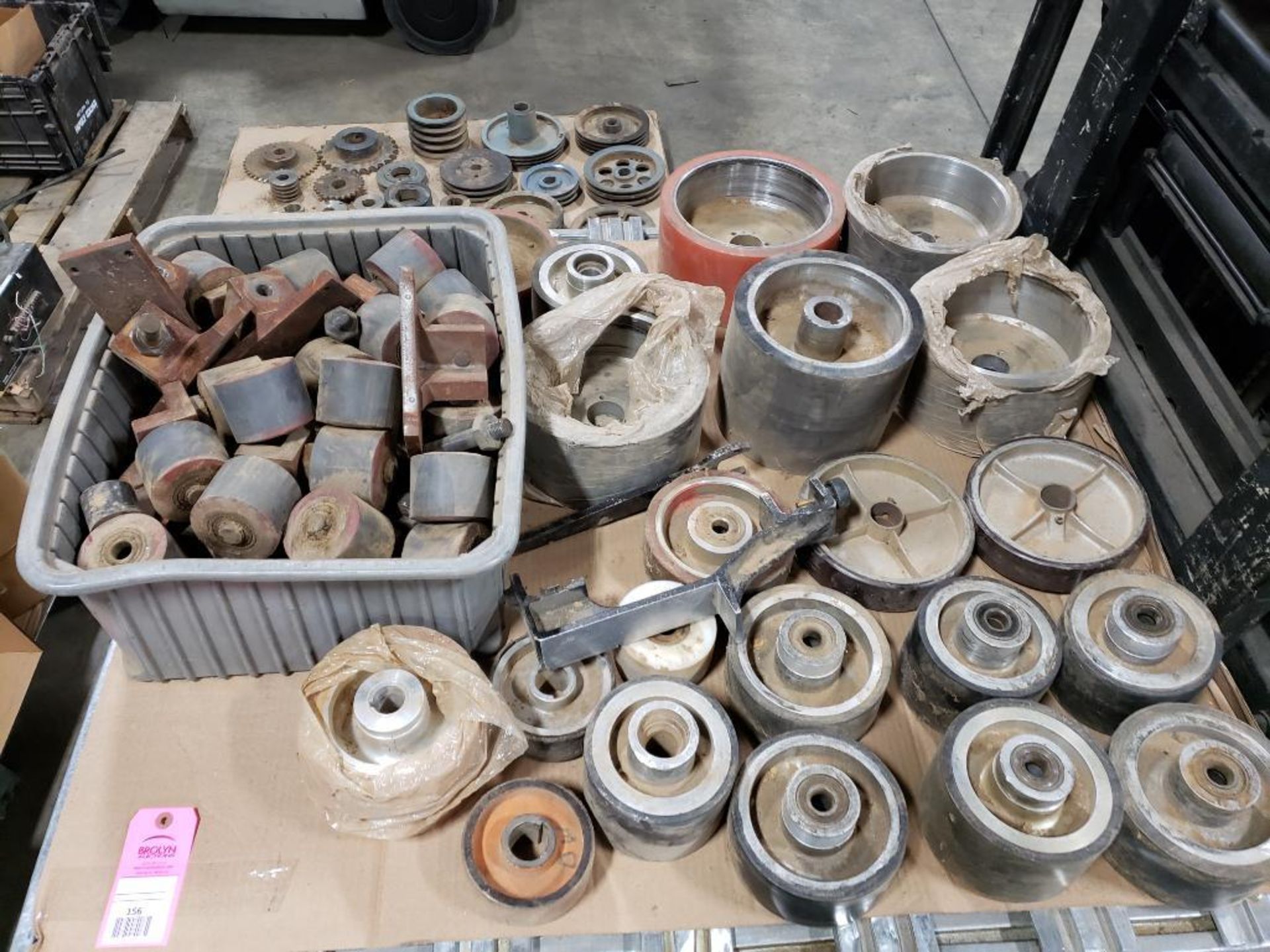 Pallet of assorted rollers press wheels.