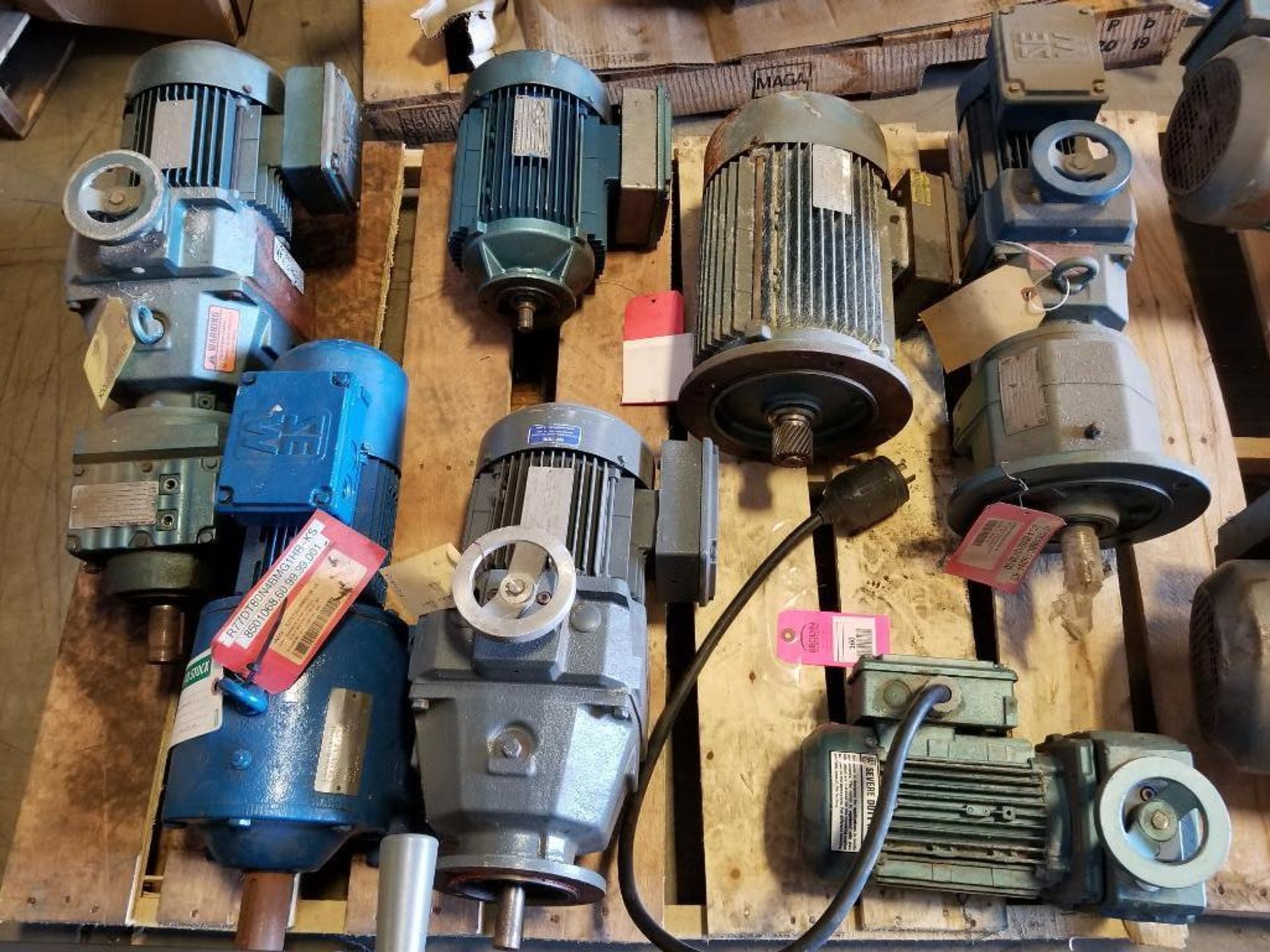 Pallet of assorted motors and gearboxes.