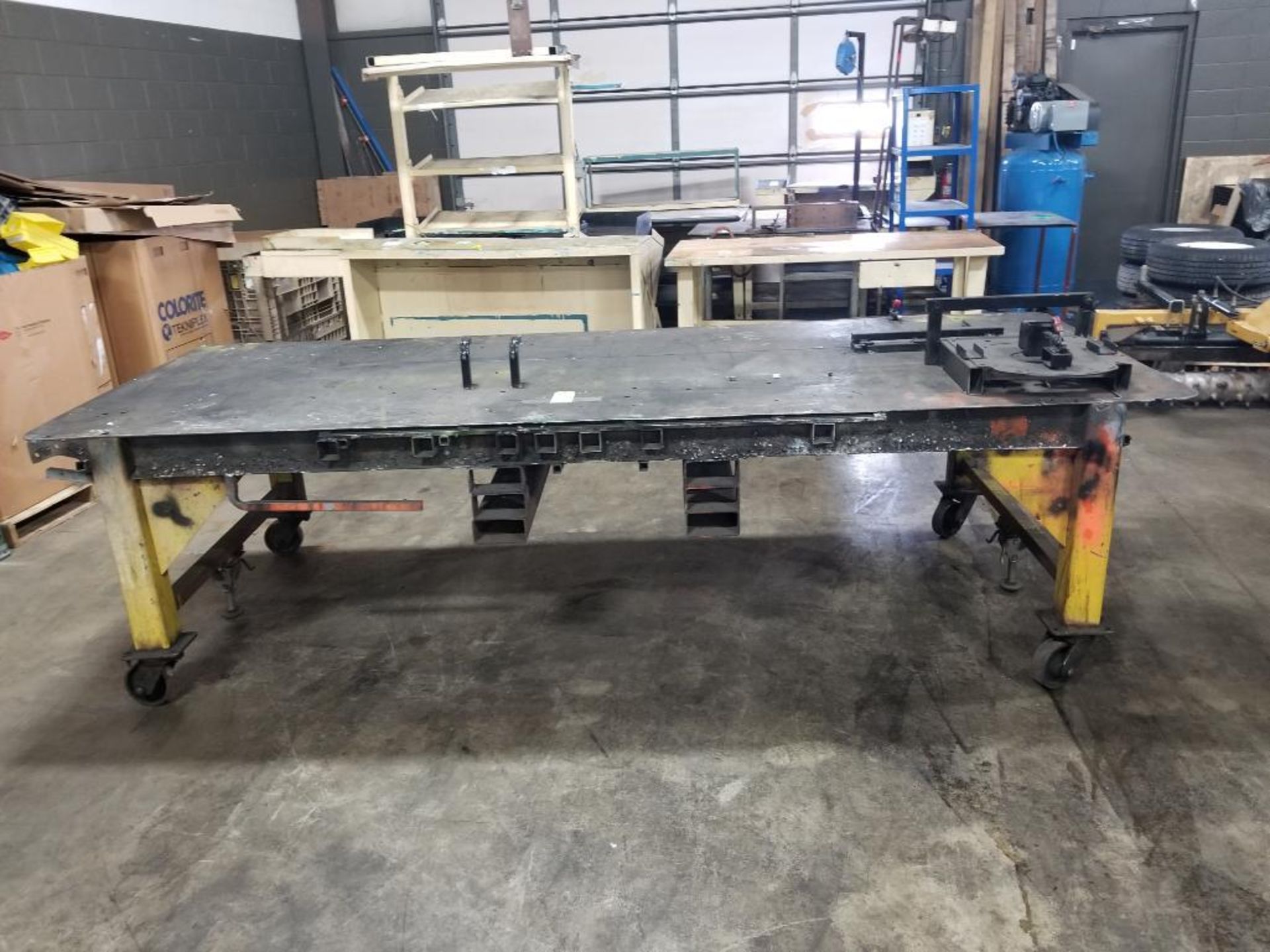 Industrial welding work table with steel tabletop and clamp fixture. 126x48x43. LxWxH.