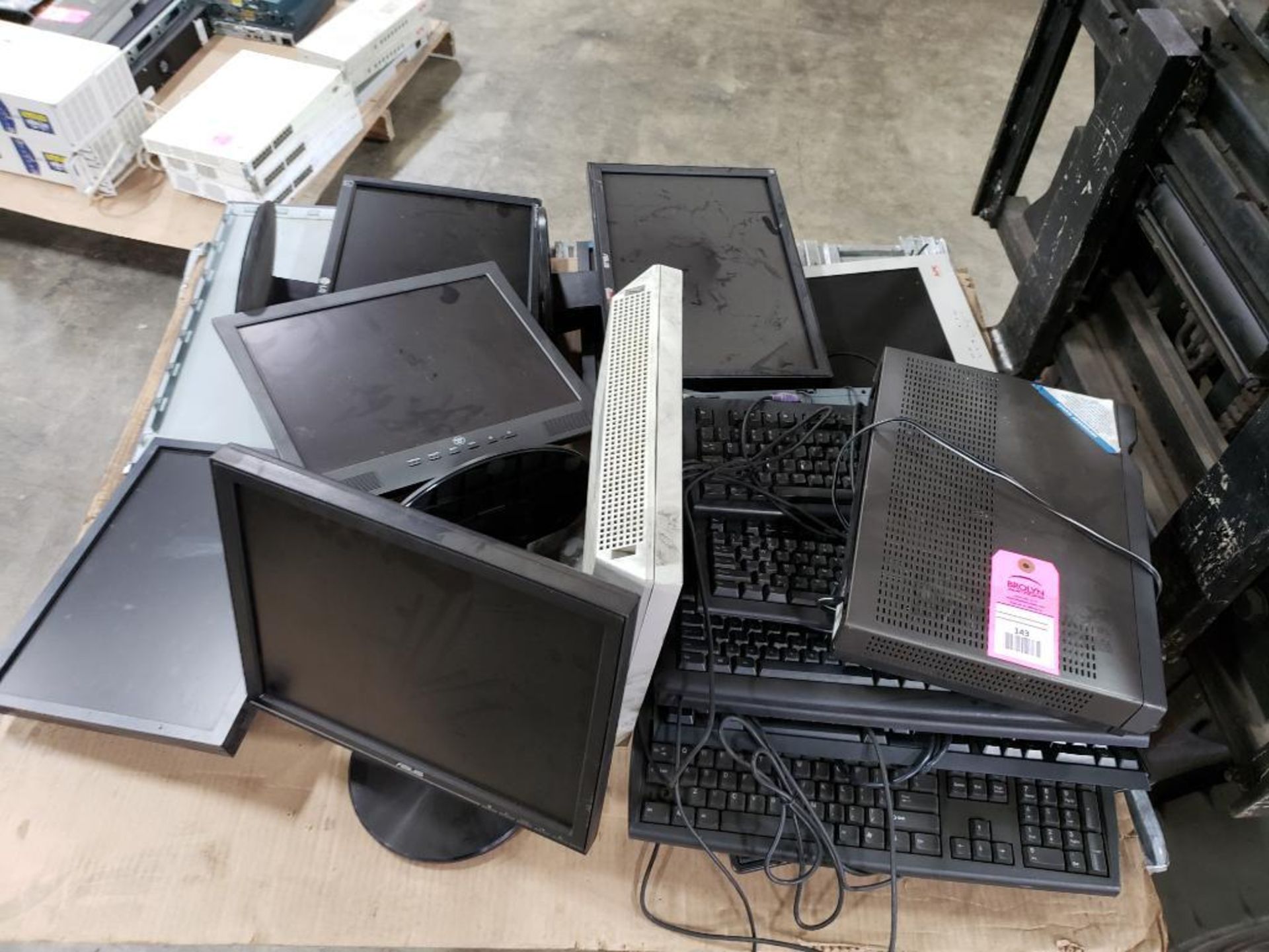 Pallet of assorted computer monitors, keyboards. Asus, Acer.