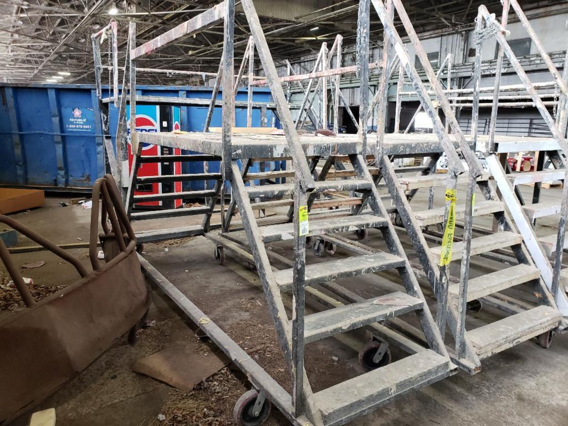 Wheeled scaffolding ladder. 18FT Long x 36" Wide x 54" Tall (to deck), 94" (overall).