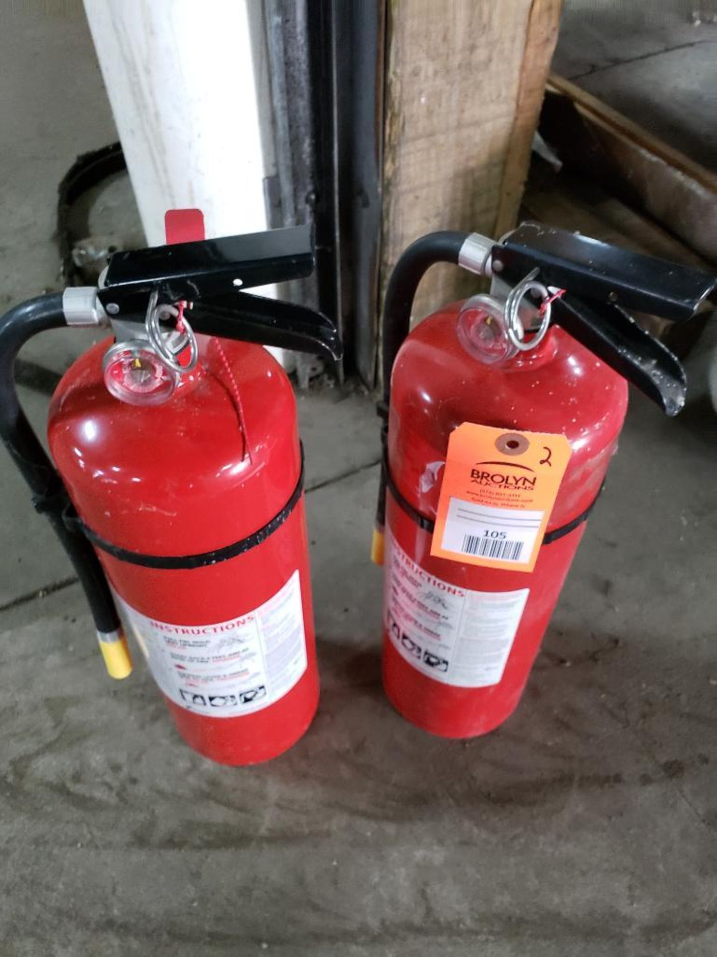 Qty 2 - Fire extinguishers.