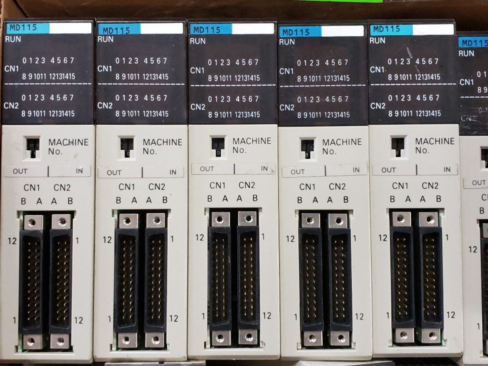 Qty 12 - Assorted Omron programmable control rack components.