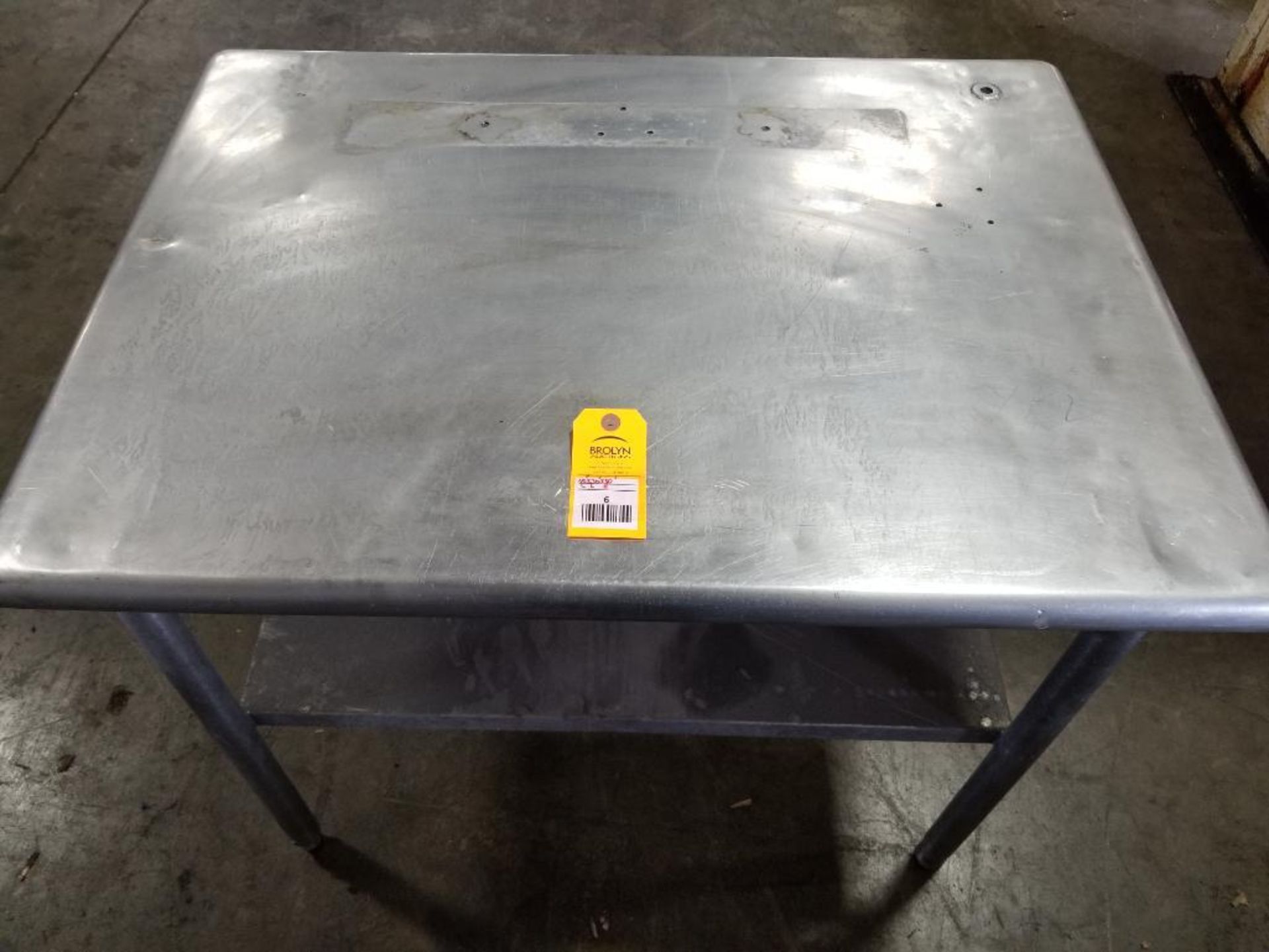 Stainless steel prep table. 40" wide x 30" deep x 30" tall.