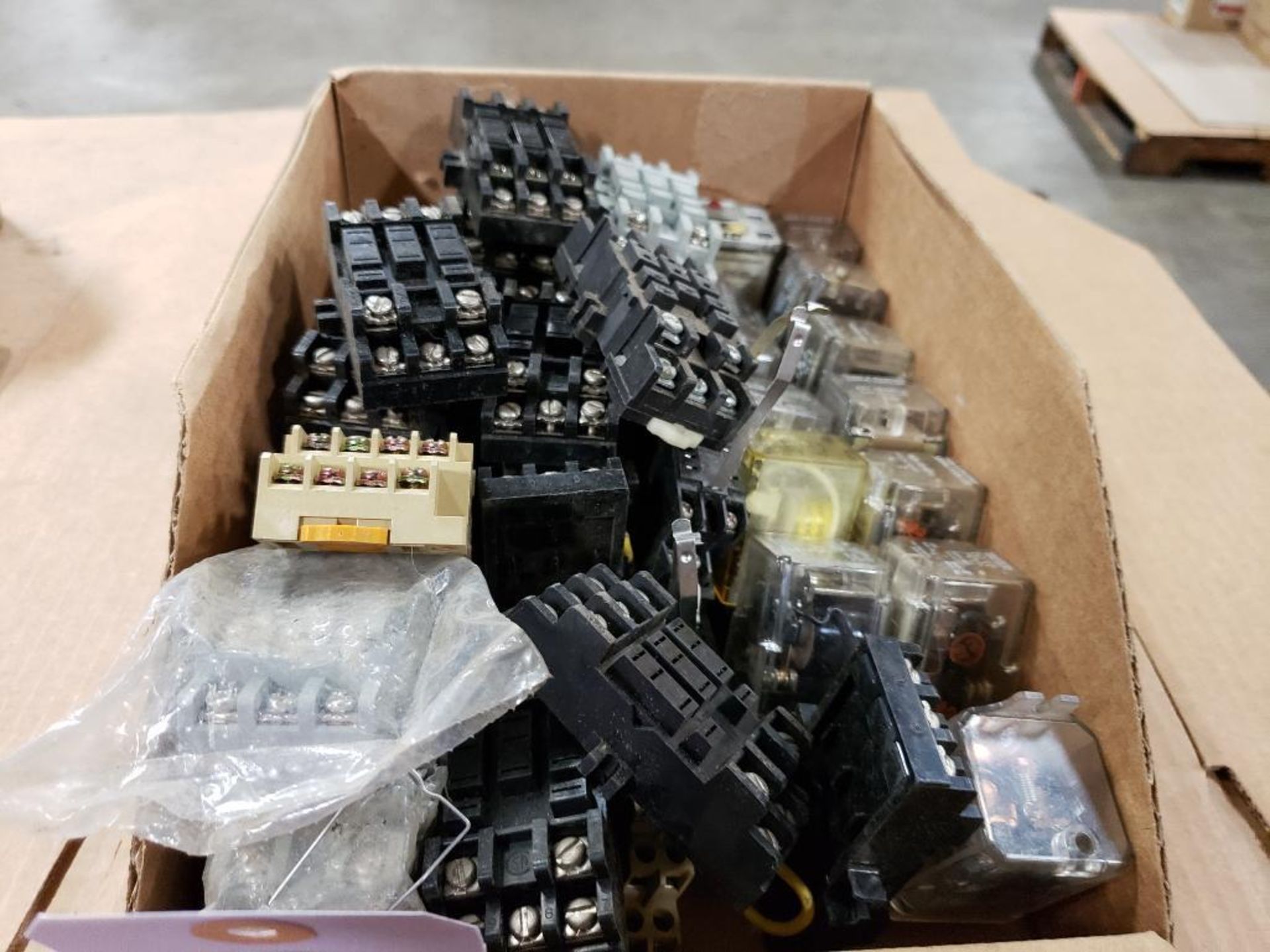 Assorted electrical relay, relay connectors, switches.