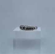 Ladies Diamond Ring, Set with small Diamonds, On an unmarked White Gold shank, Hallmarks for London,