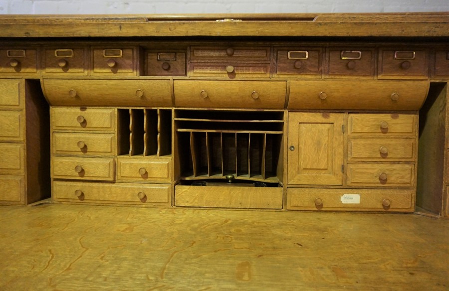 Oak Roll Top Desk, Having a Tambour Roller Shutter enclosing fitted Drawers and Pigeon Holes, Raised - Image 7 of 9