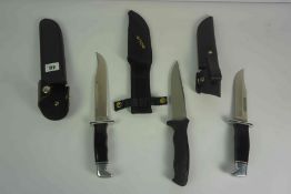 Two U.S.A Buck Knives, No 119 O, and 120 V, Both having Polished Grips with white Metal mounts,