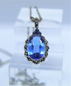 Gemstone and Diamond Pendant, The Blue Oval Cabochon measuring approximately 1cm x 2cm, Flanked with