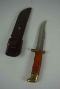 U.S.A Buck Knife, No 119 C, Having a Polished grip with Brass mounts, Blade 14.5cm long, With a