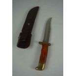 U.S.A Buck Knife, No 119 C, Having a Polished grip with Brass mounts, Blade 14.5cm long, With a