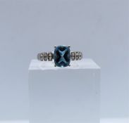 9ct Gold Aquamarine & Diamond Ladies Ring, Set with an Emerald cut Aquamarine to the centre, With