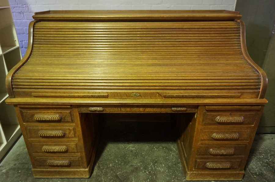 Oak Roll Top Desk, Having a Tambour Roller Shutter enclosing fitted Drawers and Pigeon Holes, Raised