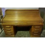 Oak Roll Top Desk, Having a Tambour Roller Shutter enclosing fitted Drawers and Pigeon Holes, Raised
